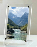 One 6-inch acrylic photo frame. Transparent and simple in style, featured with a classic tilted desktop bracket, perfect for hom